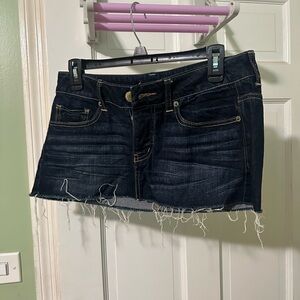 Women’s dark denim cut off mini skirt